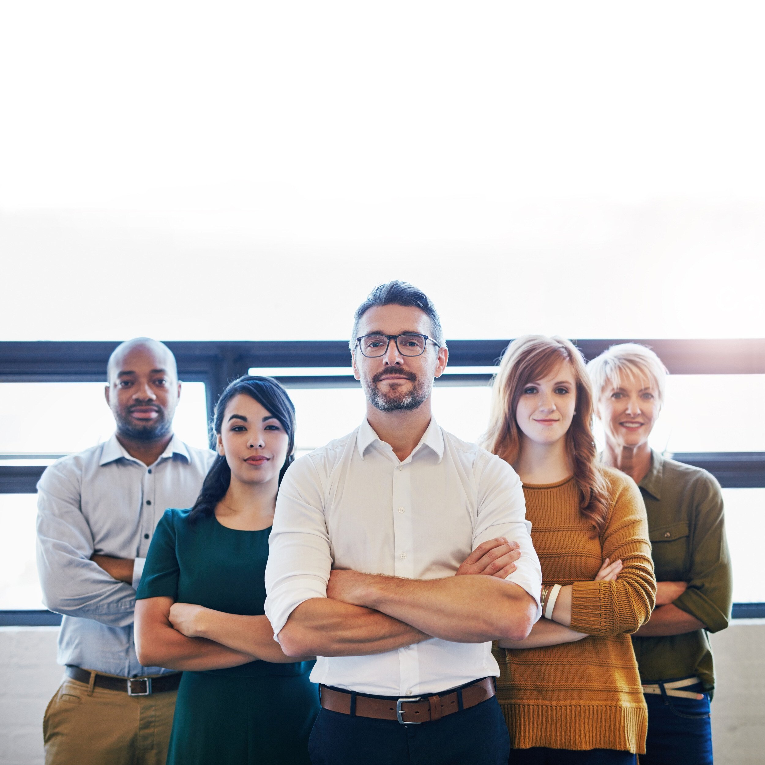 portrait-group-confident-serious-professionals-standing-together-with-arms-crossed-copyspace-serious-team-leader-manager-entrepreneur-leading-with-support-staff-colleagues